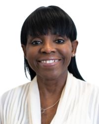 Tina jegede headshot Tina Jegede in a white shirt